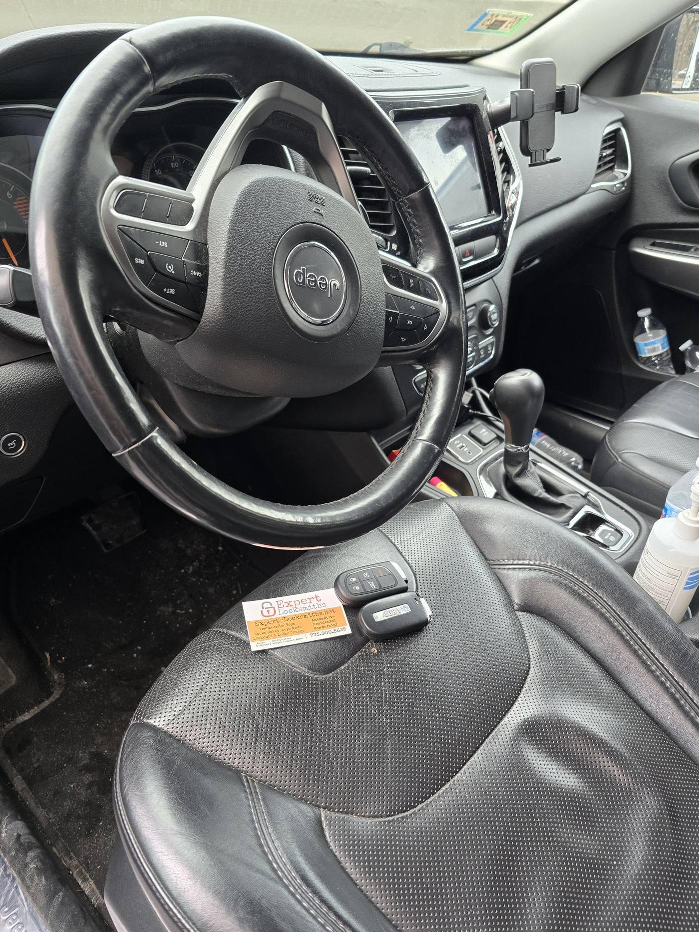Expert Locksmiths technician programming a replacement smart key for a Jeep